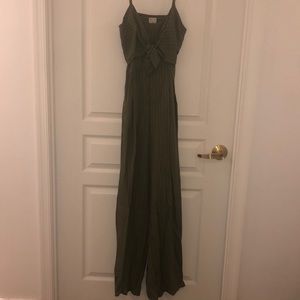 Green & white play suit w/ open back, never worn